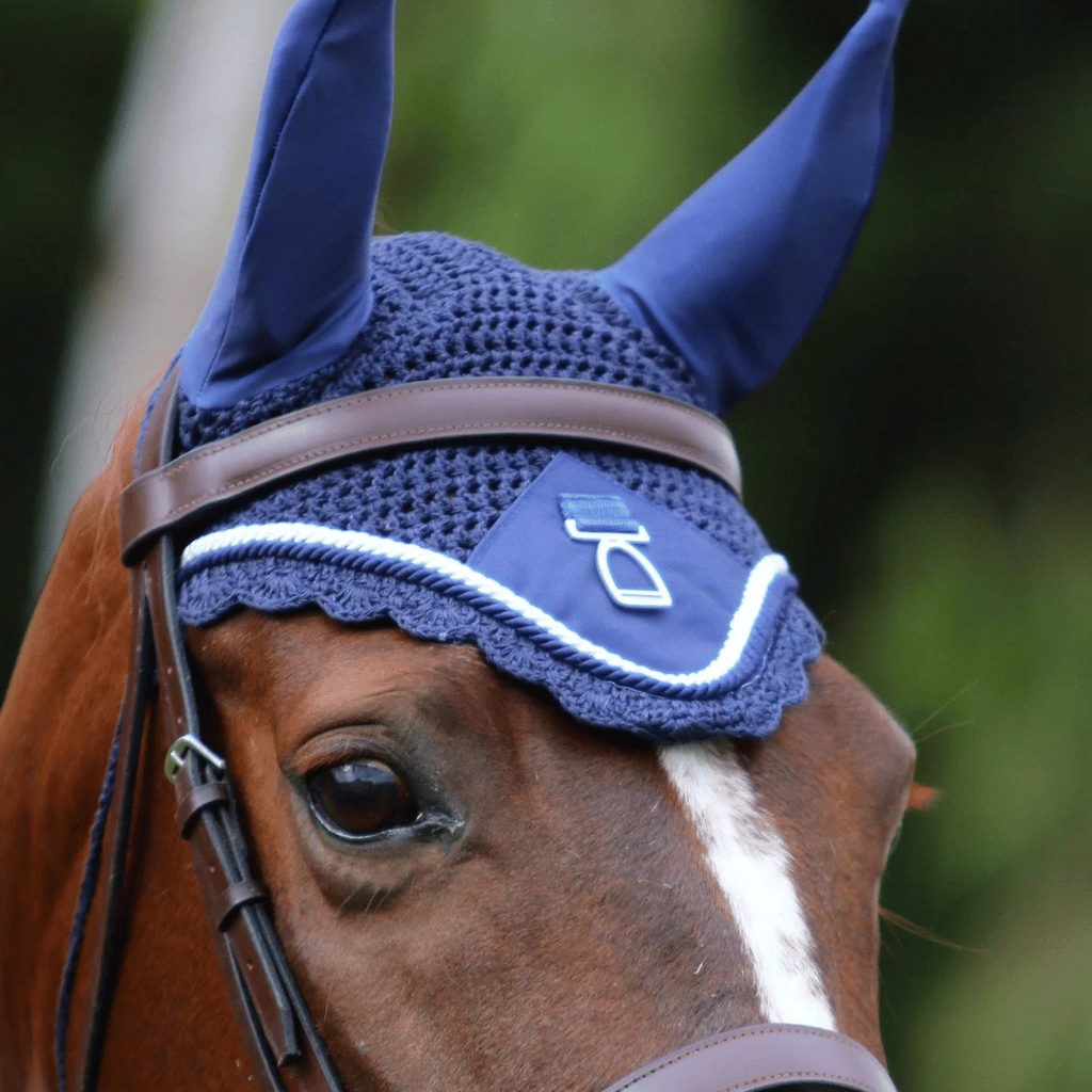Chestnut horse wearing an ear bonnet from Regent Equestrian